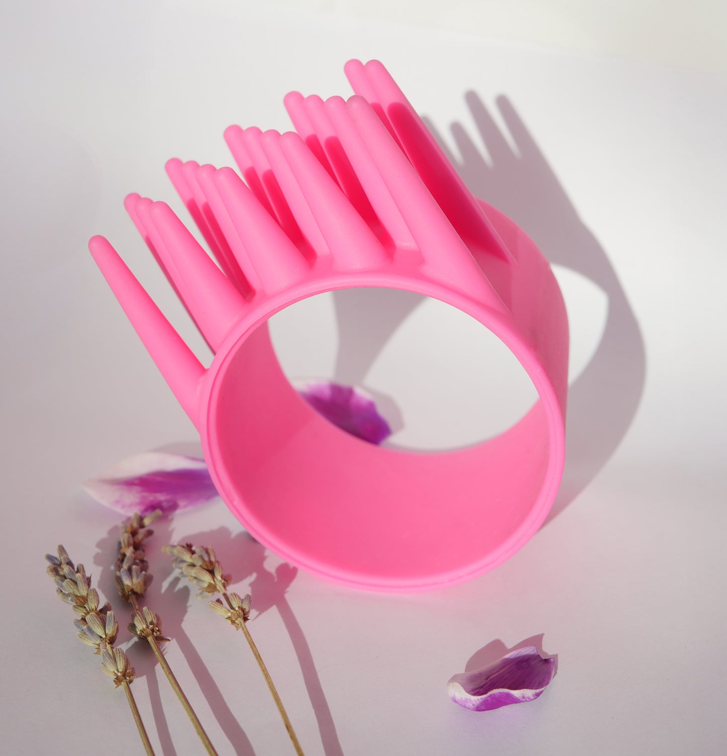 Spicy Pink DrySpike hair dryer attachment showing bristle design